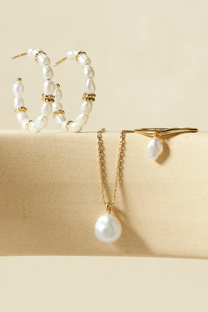 EKLEXIC WAVY RING WITH PEARL