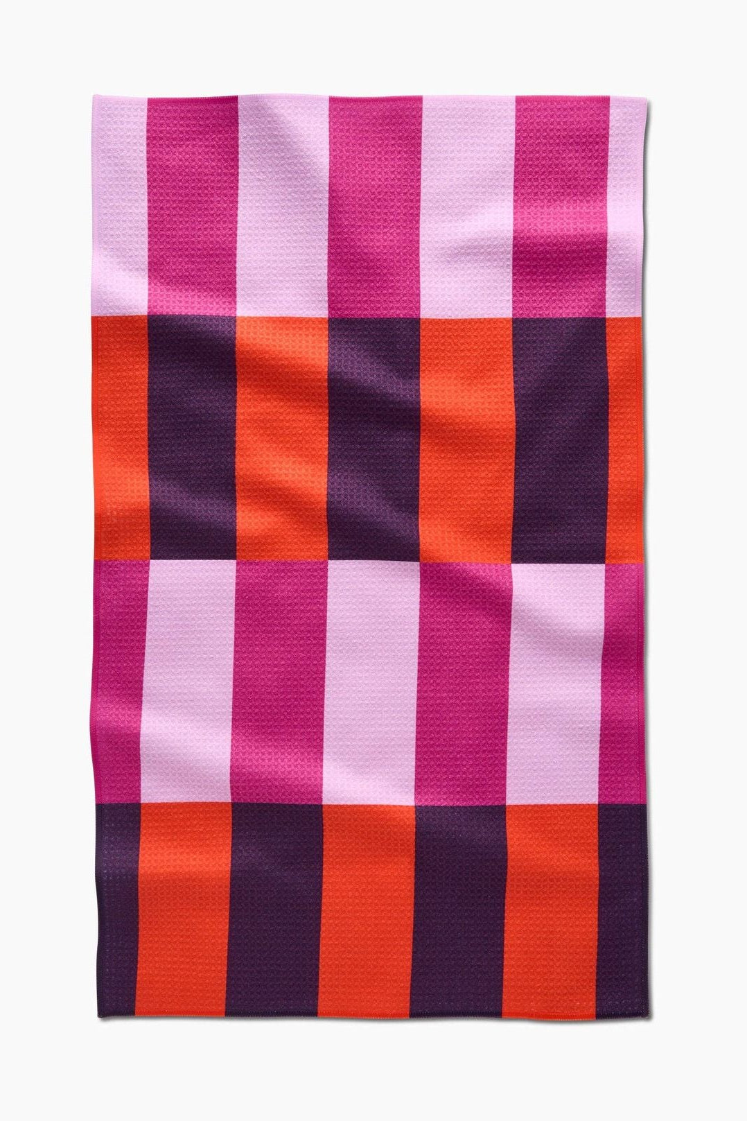 Checkered towel with pink, orange, and purple stripes on a white background